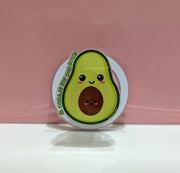 Grip magnético 3D verde en forma de aguacate con expresión furiosa — vista frontal mostrando diseño