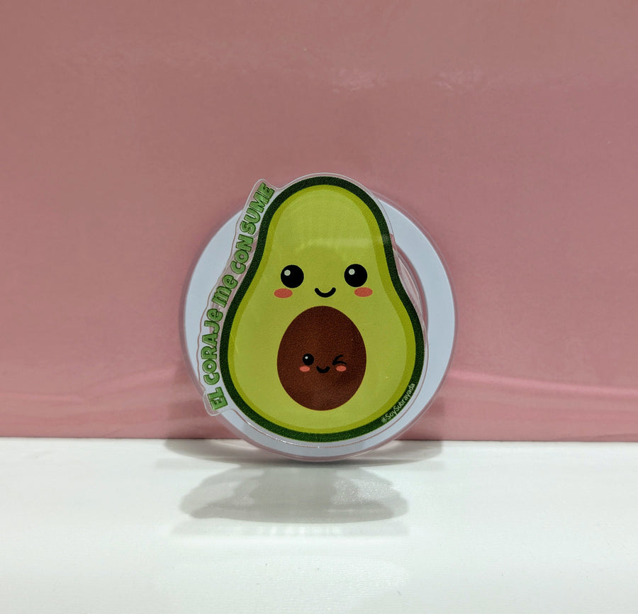 Grip magnético 3D verde en forma de aguacate con expresión furiosa — vista frontal mostrando diseño